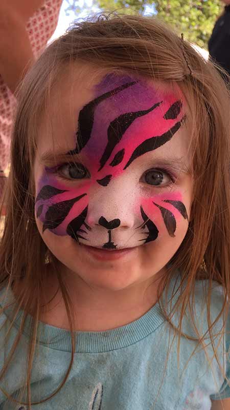 pink cat face paint child